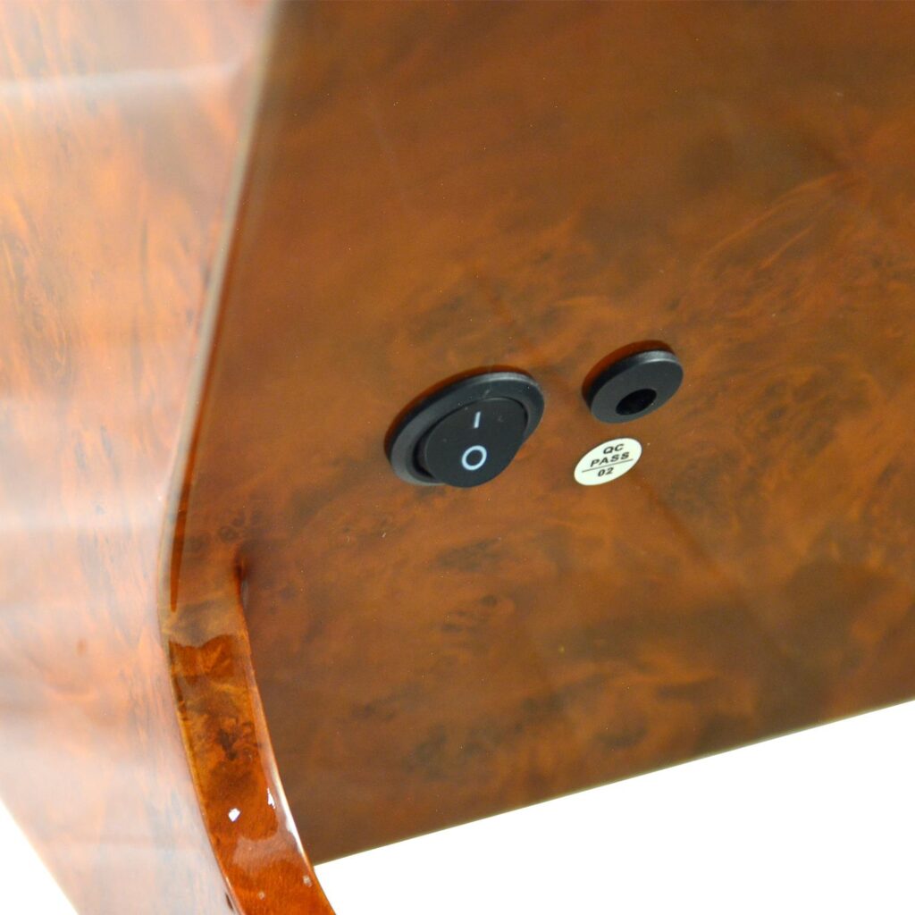 High-gloss watch winder cabinet close-up showing rear power switch and power connection