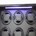 Six watch winder interior with LED light illuminating the watch holders