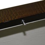 green crocodile grain watch case with close-up view of front closure hardware