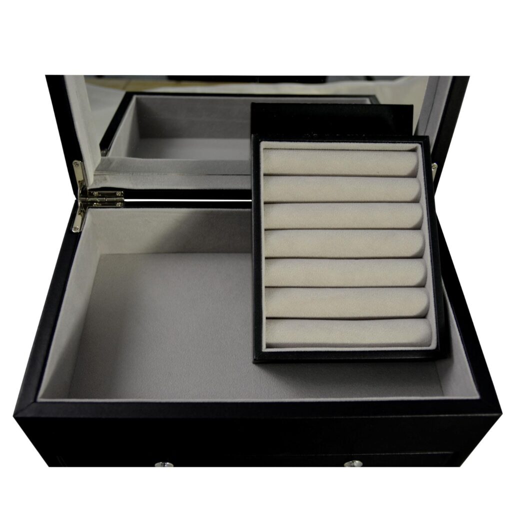 Jewelry collection box interior showing mirror and velvet lining detail
