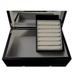 Jewelry collection box interior showing mirror and velvet lining detail