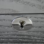 watch case hinge hardware detail with black wood finish