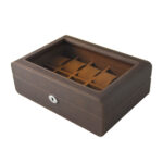 Open brown watch display case with organized watch compartments