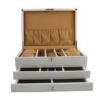 Open jewelry case with ring rolls compartments and pull-out drawers