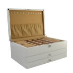 White lacquer jewelry organizer with camel velvet interior layout