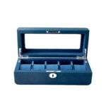 Open blue watch display box with five watch cushions