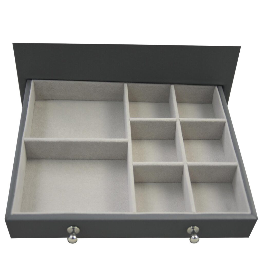 Open grey jewelry case with velvet compartments and storage sections