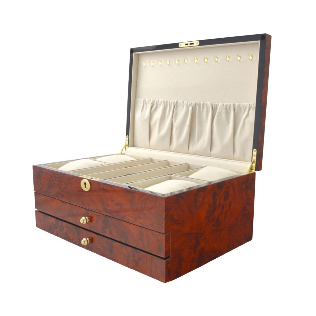 Open jewelry box showing beige velvet interior compartments
