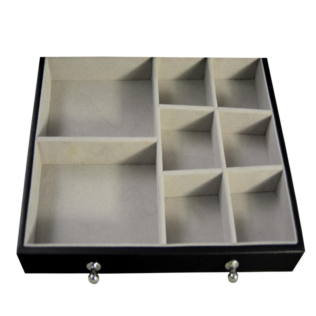 Jewelry collection box interior with ring rolls and organized compartments