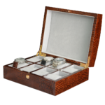 Brown crocodile grain watch case displaying automatic watches