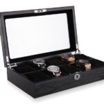 10 watch case showing watches on velvet cushions with glass display window