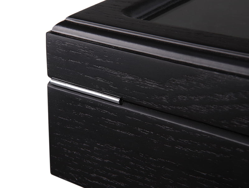 watch case metal hinge detail with black wood veneer exterior