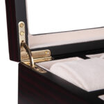 Watch display case with gold-tone metal lid support and beige velvet-wrapped interior