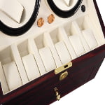 Watch winder interior with six beige watch storage positions and knob controls