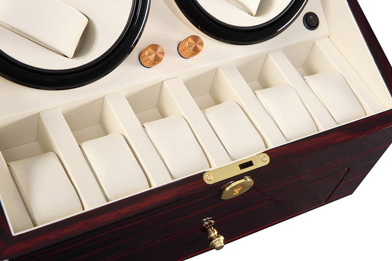 Watch winder interior with six beige watch storage positions and knob controls