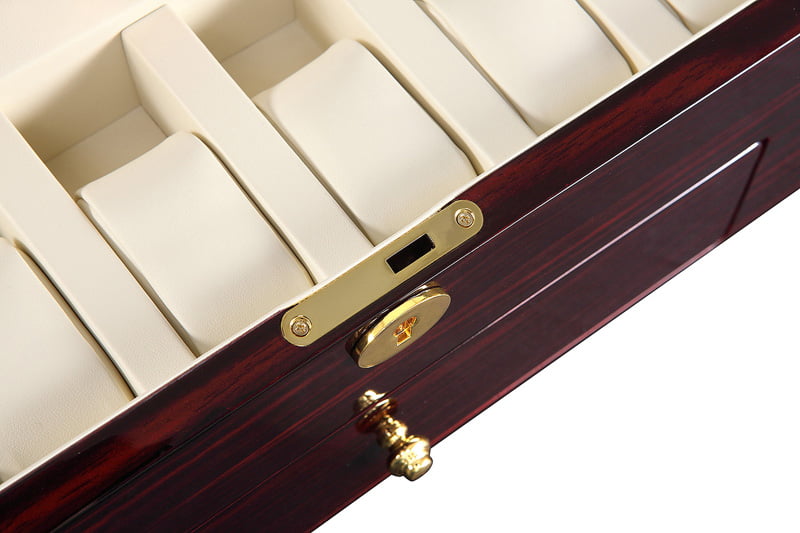 Ebony watch winder with beige storage positions and gold-tone hardware lock