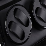 4-watch winder close-up showing black dual watch cushions and PU leather-wrapped interior