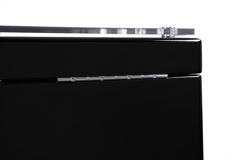 Black 4-watch winder close-up showing rear metal hinge and acrylic lid edge