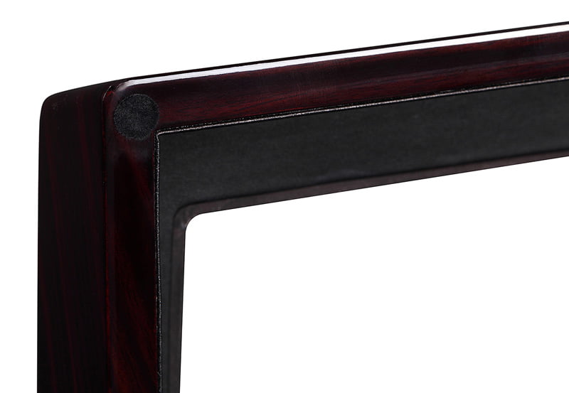 Ebony high-gloss watch winder lid corner with black trim around the display window