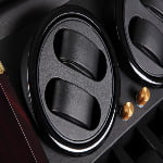 Watch winder winding module detail with black watch holders and gold-tone control knobs
