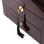 Ebony high-gloss watch winder drawer with gold-tone hardware and key lock detail