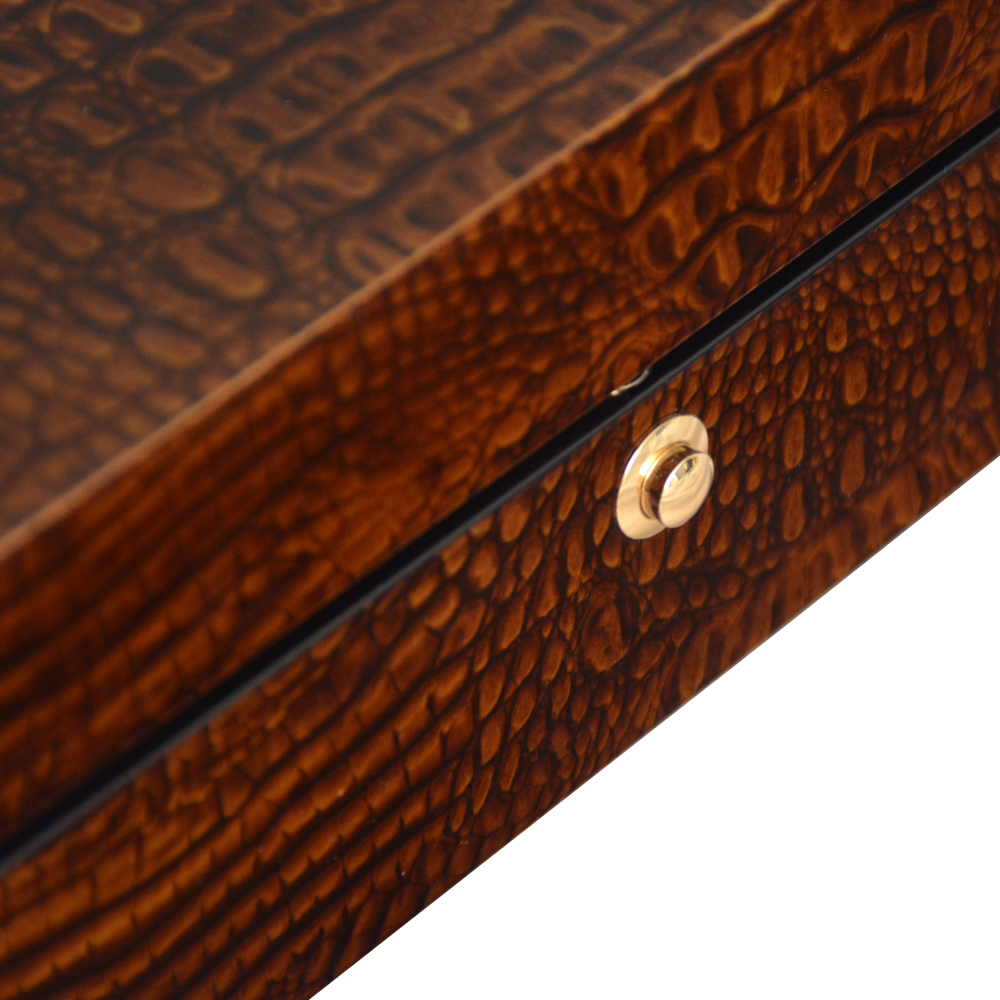 Brown crocodile grain watch case with glossy lacquered exterior finish