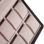 12 watch case interior with beige velvet-wrapped compartments and individual padded holders