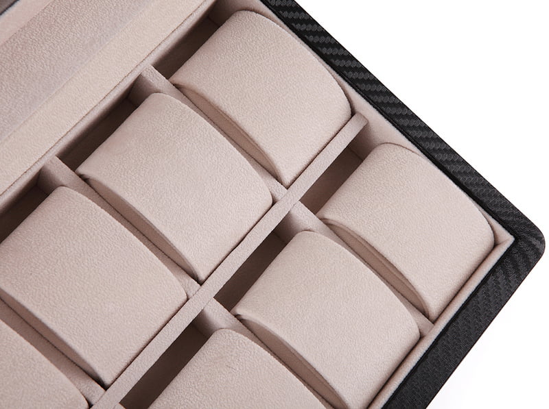 12 watch case interior with beige velvet-wrapped compartments and individual padded holders