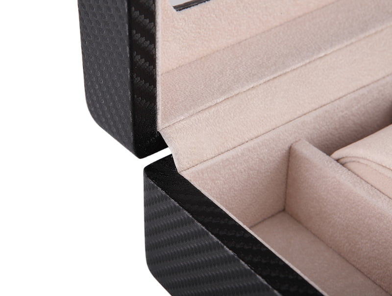 Carbon fiber watch case with beige velvet-wrapped interior and padded watch holder
