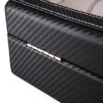 Black carbon fiber watch case with rear metal hinge and contrast stitching