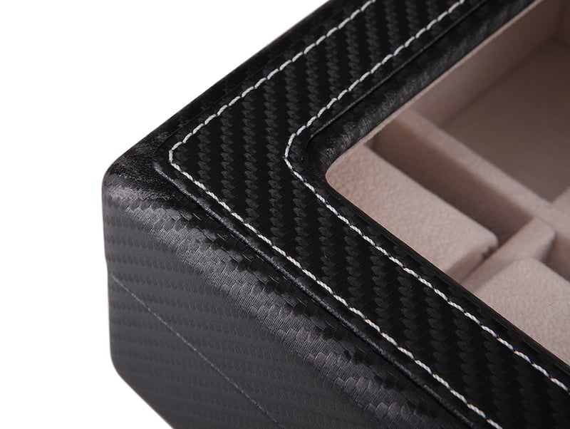 Black carbon fiber watch case corner with contrast stitching around the display window