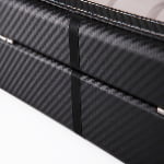 Black carbon fiber watch case exterior with rear closure detail