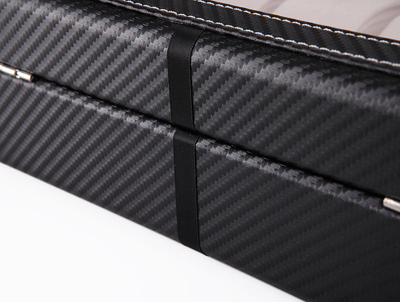 Black carbon fiber watch case exterior with rear closure detail