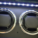 2 watch winder interior with LED light, two black watch cushions and chrome-trimmed winding positions