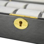 Gold hardware lock detail on black PU leather watch box