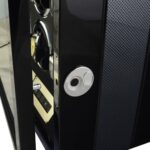 Close-up of 4 watch winder fingerprint lock beside carbon fibre exterior panel