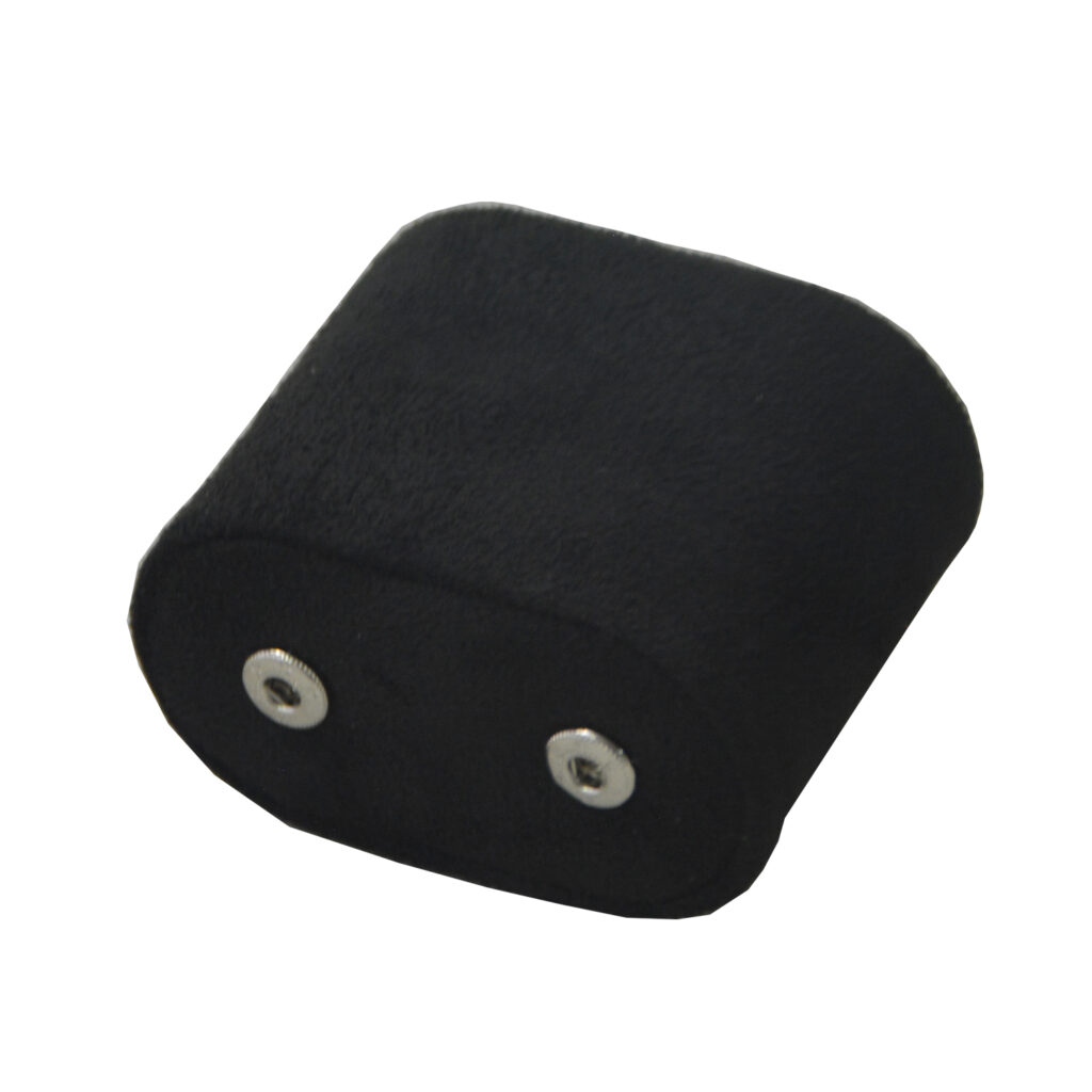 Black velvet-lined watch cushion component with two metal snap button fasteners
