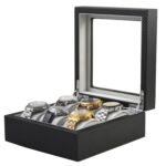 Open carbon fiber 6-watch box displaying six watches on grey velvet cushions