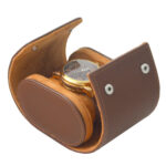 Open brown pebbled grain PU leather travel box holding one watch