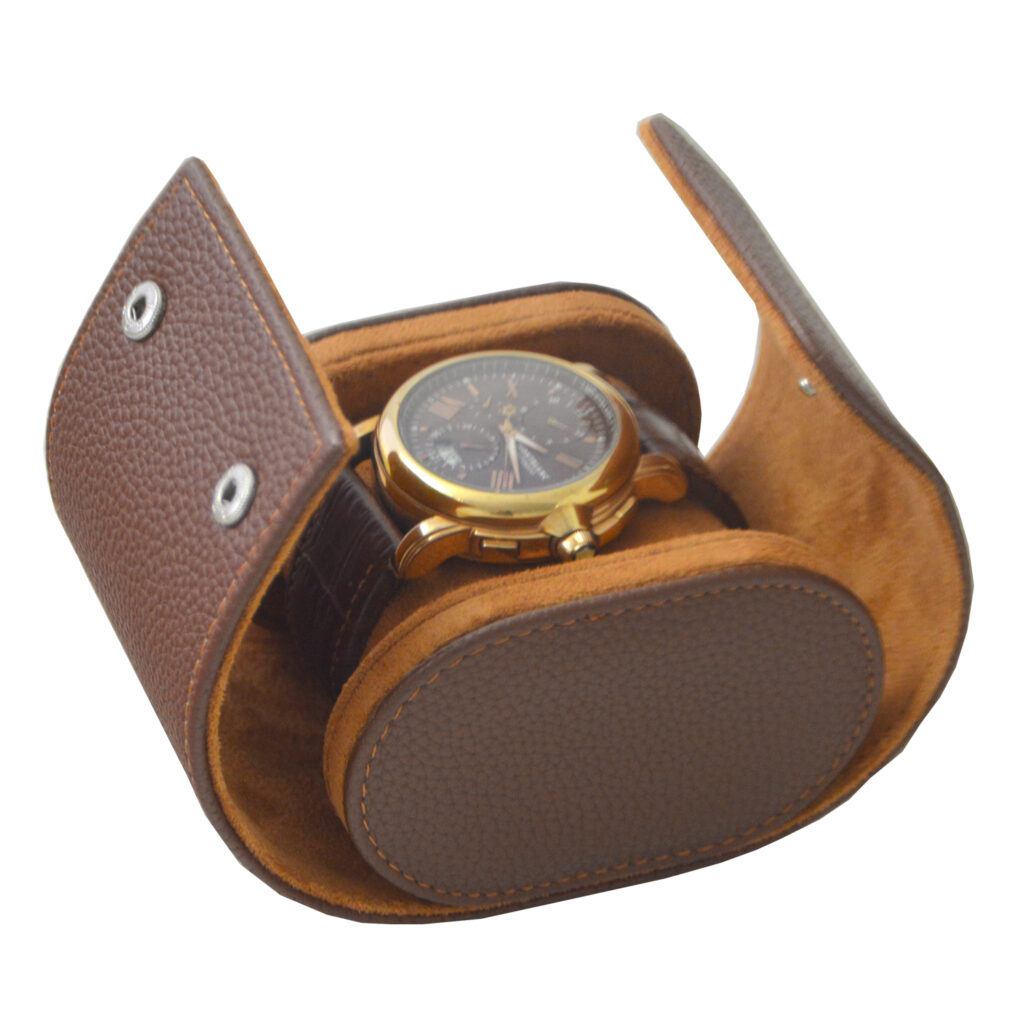Open single watch travel case with brown velvet lining, cushion and snap closures