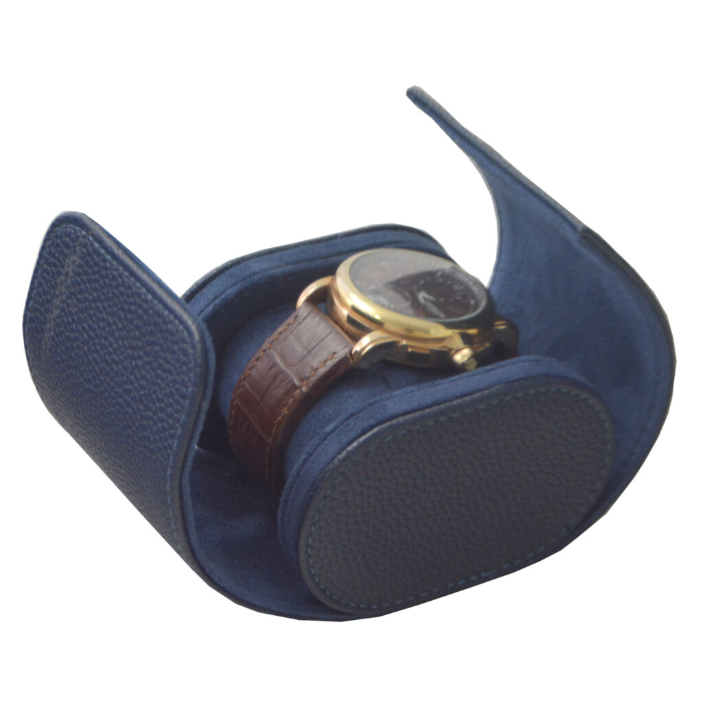 Blue pebbled PU leather watch roll opened with watch secured on cushion