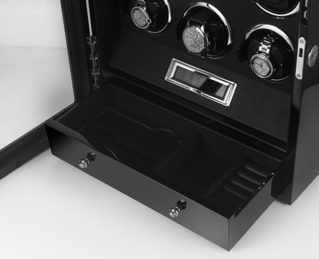 Watch winder storage drawer with remote control and black interior compartments