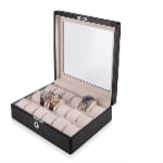 Open 18 watch case with beige watch cushions and carbon fiber-wrapped exterior