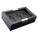 Wooden perfume display case open with black interior and bottle positions