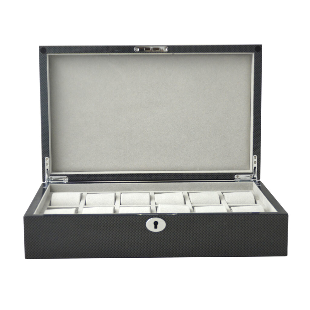 Carbon fiber watch box open with velvet interior and watch compartments