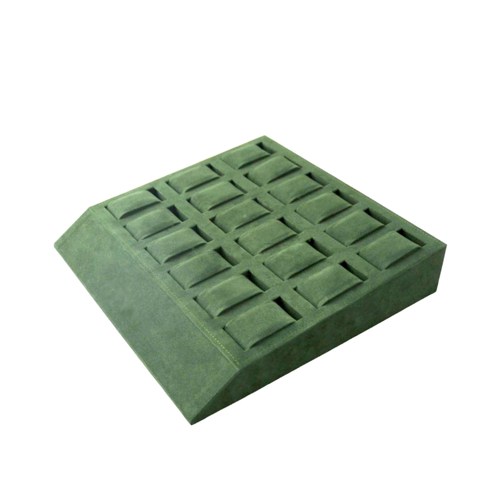 Green velvet watch tray showing raised compartment layout