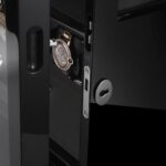 Watch winder case door lock detail with black lacquered finish