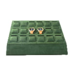 Green velvet watch presentation tray with organized slots