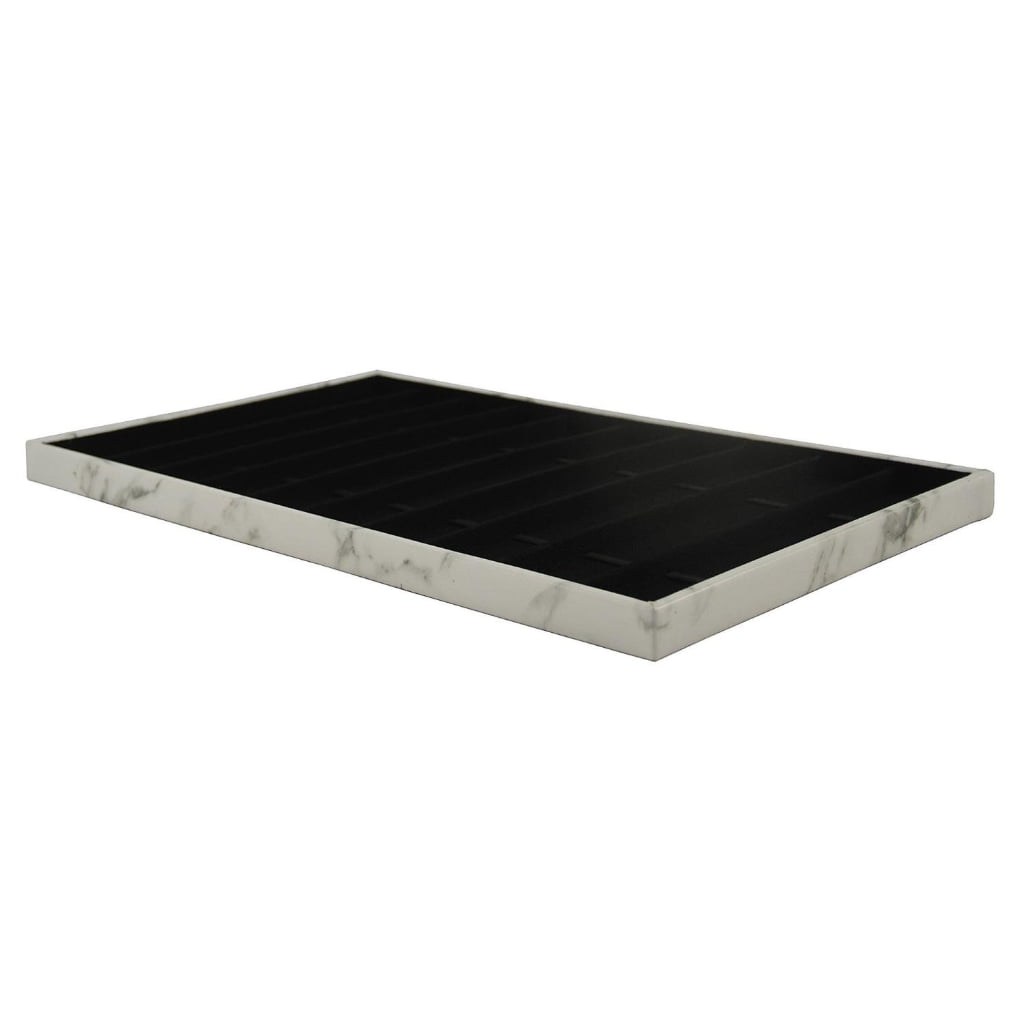 White marble watch display tray with black strap compartments
