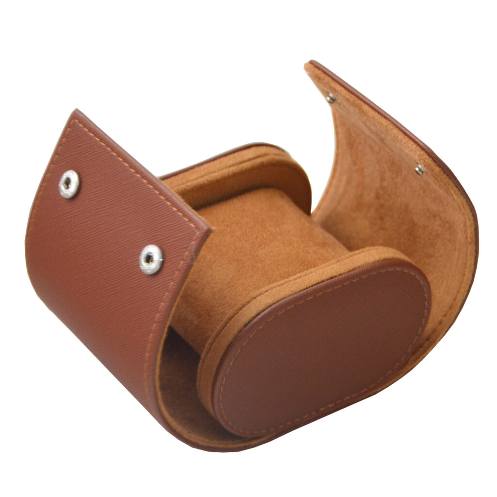 Open brown watch travel box with velvet-lined interior and watch cushion